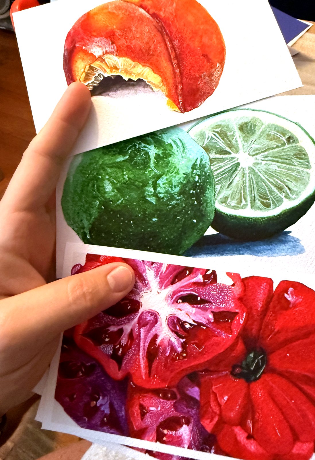 Signed watercolor art cards from The Painting Post held in hand